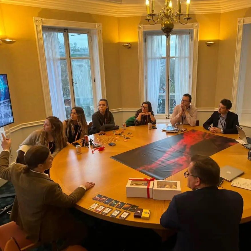 The start of an SOE. Clients sit around a table listening to the introduction from Shell