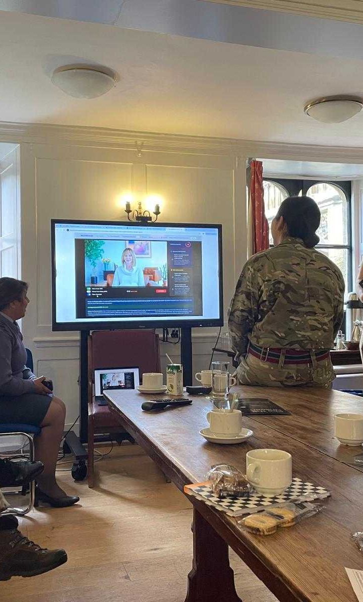 Military personnel engaging with the SOE avatar.